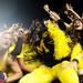 Michigan junior quarterback Denard Robinson celebrates in the stands with the fans after Michigan beat Notre Dame 35-31 during the first-ever night game at Michigan Stadium on Saturday. Melanie Maxwell I AnnArbor.com